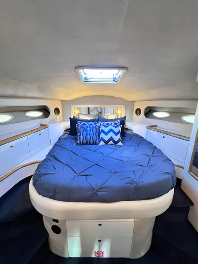 Rising Tide Yacht Photos Pics Luxurious 1996 Sea Ray 400 Sedan Bridge cabin with cozy bed and stylish decor.