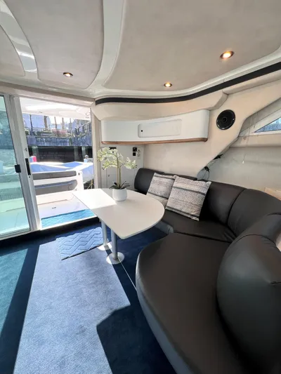 Rising Tide Yacht Photos Pics Luxurious interior of a 1996 Sea Ray 400 Sedan Bridge yacht with modern seating.