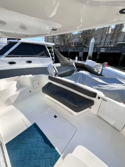 Rising Tide Yacht Photos Pics 1996 Sea Ray 400 Sedan Bridge yacht with spacious deck and seating area.