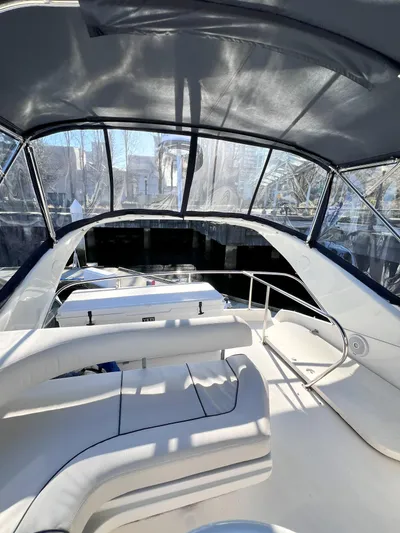 Rising Tide Yacht Photos Pics 1996 Sea Ray 400 Sedan Bridge interior with seating and canopy.