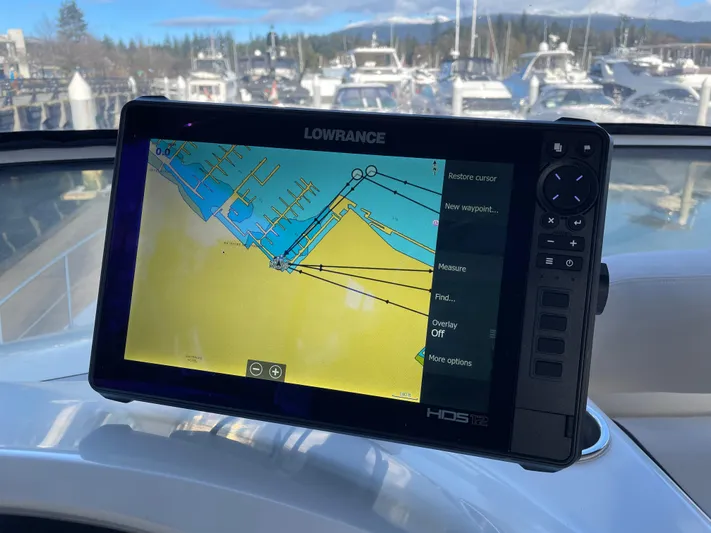 Rising Tide Yacht Photos Pics Lowrance navigation system on 1996 Sea Ray 400 Sedan Bridge, displaying nautical map.