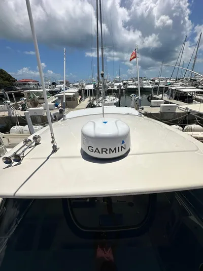  Yacht Photos Pics 2013 Grady-White Express 330 boat with Garmin radar, docked in a marina under cloudy skies.