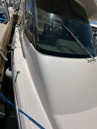  Yacht Photos Pics 2013 Grady-White Express 330 boat docked, showcasing sleek design and windshield.