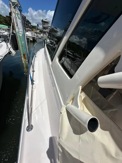  Yacht Photos Pics 2013 Grady-White Express 330 boat docked, side view with railing and windows.