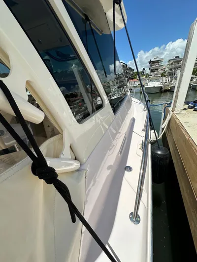  Yacht Photos Pics 2013 Grady-White Express 330 docked at marina, sunny day, clear skies.