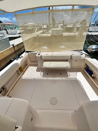  Yacht Photos Pics 2013 Grady-White Express 330 boat interior with seating and marina view.