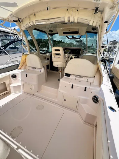  Yacht Photos Pics 2013 Grady-White Express 330 boat interior with helm and seating area.