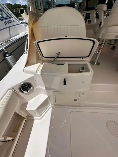  Yacht Photos Pics 2013 Grady-White Express 330 boat interior with open storage compartment and seating.