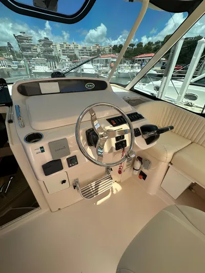  Yacht Photos Pics 2013 Grady-White Express 330 boat helm with steering wheel and controls.