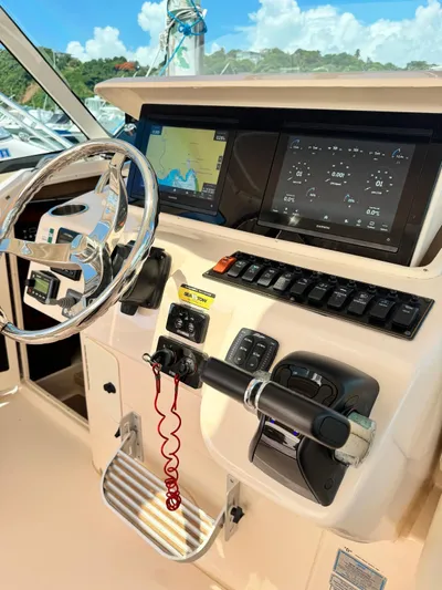  Yacht Photos Pics 2013 Grady-White Express 330 helm with navigation screens and controls.