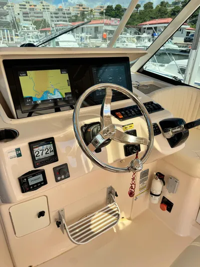  Yacht Photos Pics 2013 Grady-White Express 330 helm with navigation display and controls.