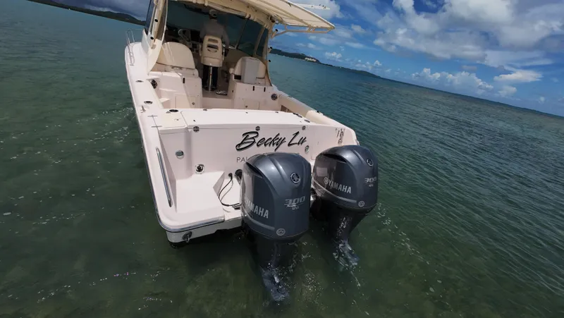  Yacht Photos Pics 2013 Grady-White Express 330 boat with twin Yamaha engines on clear water.