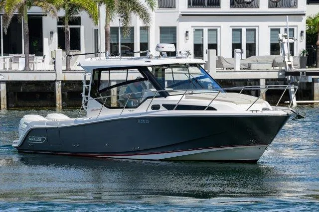 325 Boston Whaler W/ Seakeeper Stabilizer & Ride Yacht Photos Pics 2020 Boston Whaler 325 Conquest boat on water near waterfront homes.