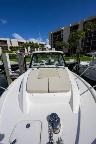 325 Boston Whaler W/ Seakeeper Stabilizer & Ride Yacht Photos Pics 2020 Boston Whaler 325 Conquest boat docked at marina, sunny day.