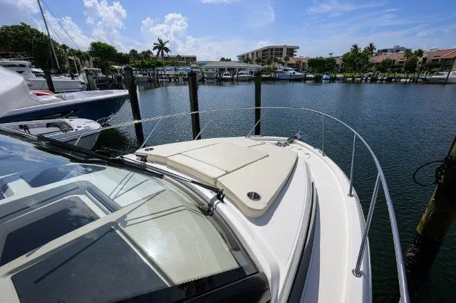 325 Boston Whaler W/ Seakeeper Stabilizer & Ride Yacht Photos Pics 2020 Boston Whaler 325 Conquest docked in a sunny marina.