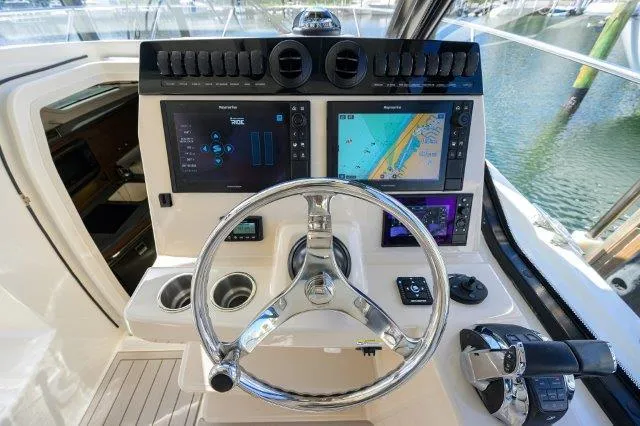 325 Boston Whaler W/ Seakeeper Stabilizer & Ride Yacht Photos Pics Helm of 2020 Boston Whaler 325 Conquest with advanced navigation displays and controls.