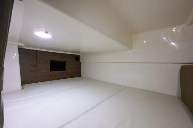 325 Boston Whaler W/ Seakeeper Stabilizer & Ride Yacht Photos Pics Interior cabin of 2020 Boston Whaler 325 Conquest, featuring sleek white design and lighting.