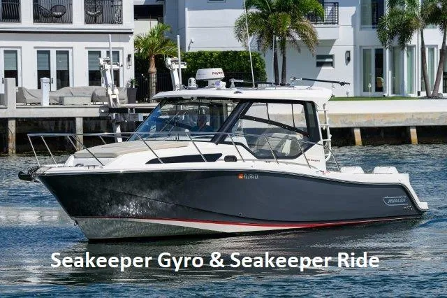 325 Boston Whaler W/ Seakeeper Stabilizer & Ride Yacht Photos Pics 2020 Boston Whaler 325 Conquest boat with Seakeeper Gyro and Ride, docked near waterfront homes.