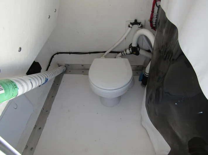  Yacht Photos Pics 2023 Twin Vee 340 GFX CC boat interior with marine toilet setup.
