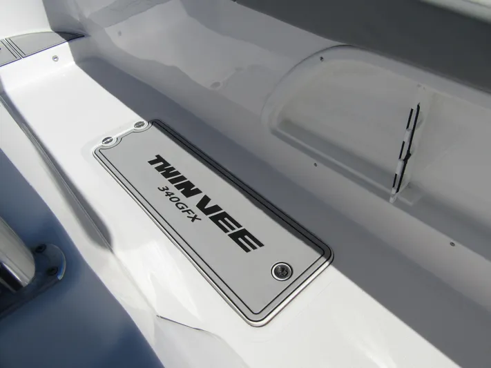  Yacht Photos Pics 2023 Twin Vee 340 GFX CC boat interior detail with logo.