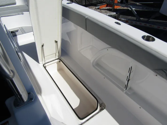 Yacht Photos Pics 2023 Twin Vee 340 GFX CC boat storage compartment, open lid, sleek white interior design.