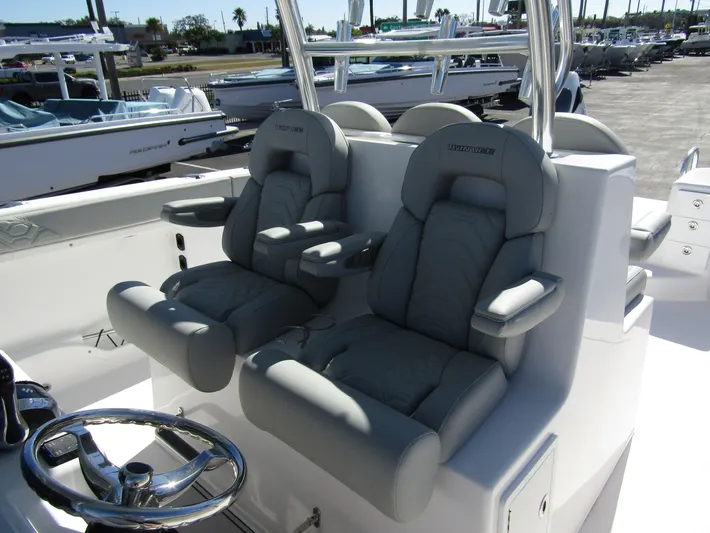  Yacht Photos Pics 2023 Twin Vee 340 GFX CC boat with luxurious gray seating and steering wheel.
