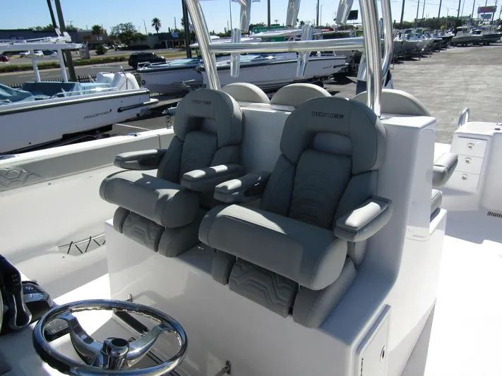  Yacht Photos Pics 2023 Twin Vee 340 GFX CC boat with plush gray seating and steering wheel.