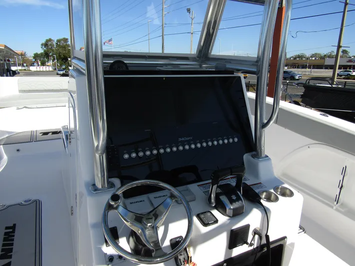  Yacht Photos Pics 2023 Twin Vee 340 GFX CC boat dashboard with steering wheel and controls.