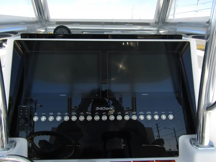  Yacht Photos Pics 2023 Twin Vee 340 GFX CC dashboard with dual screens and control buttons.