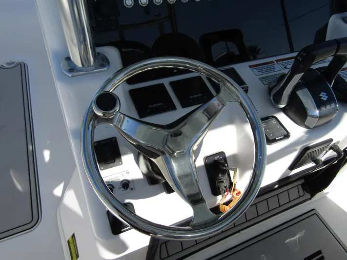  Yacht Photos Pics 2023 Twin Vee 340 GFX CC boat steering wheel and control panel.