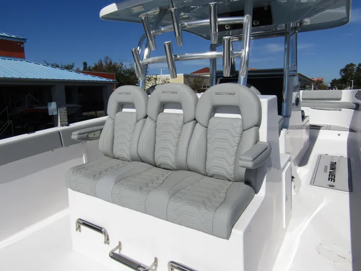  Yacht Photos Pics 2023 Twin Vee 340 GFX CC boat with luxurious gray seating and sleek design.