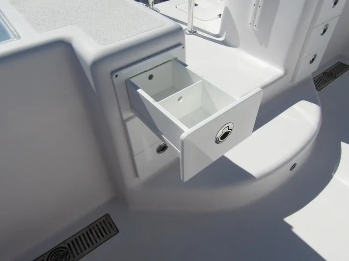 Yacht Photos Pics 2023 Twin Vee 340 GFX CC boat interior with open storage compartment.