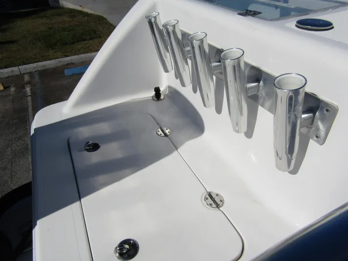  Yacht Photos Pics 2023 Twin Vee 340 GFX CC boat with rod holders and storage compartment.
