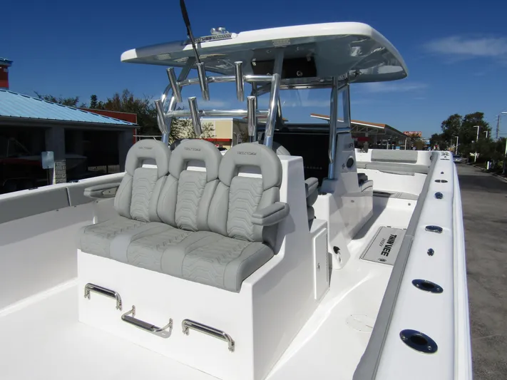  Yacht Photos Pics 2023 Twin Vee 340 GFX CC boat with cushioned seating and sleek design.