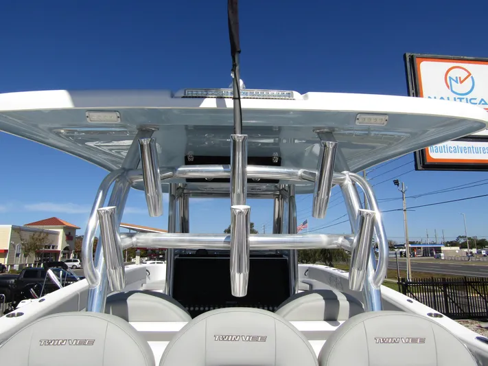  Yacht Photos Pics 2023 Twin Vee 340 GFX CC boat with T-top and rod holders, outdoor display.