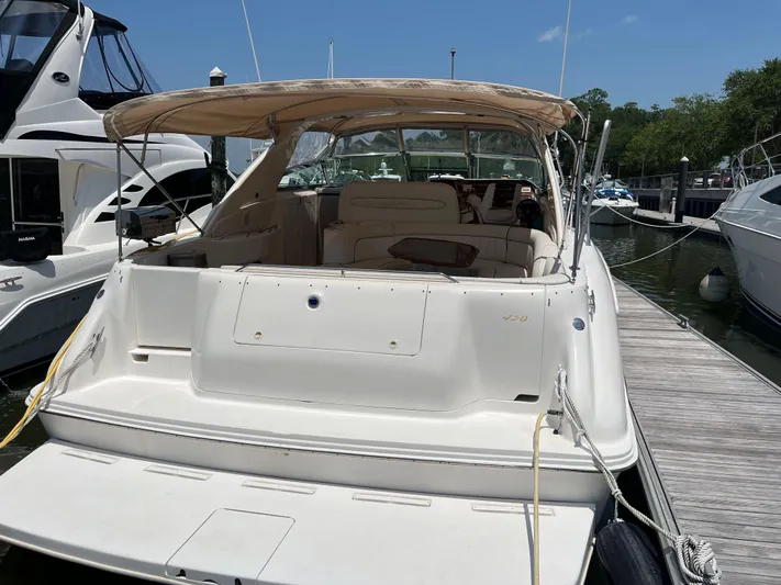  Yacht Photos Pics 1998 Sea Ray 450 Sundancer docked at marina, rear view.