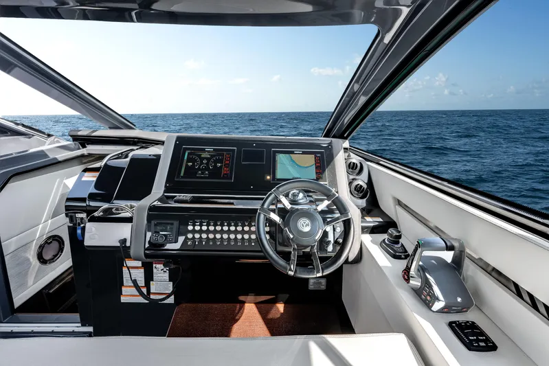  Yacht Photos Pics 2023 Cruisers Yachts 42 GLS OB helm with modern controls and ocean view.