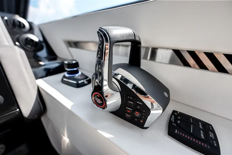  Yacht Photos Pics 2023 Cruisers Yachts 42 GLS OB throttle controls on sleek white dashboard.