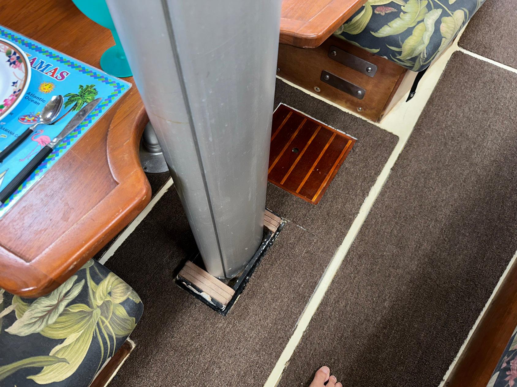 Interior of 1987 Pearson 36-2 sailboat showing mast and seating area.