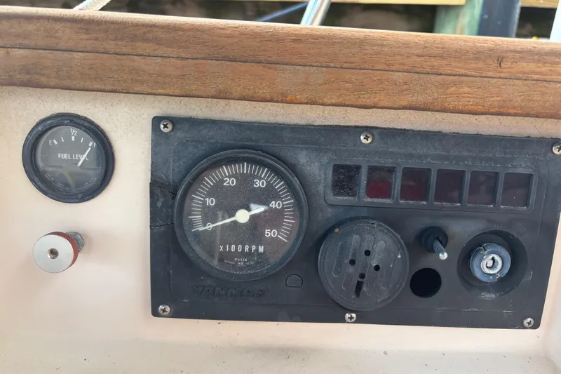 Starlight Yacht Photos Pics Control panel of a 1995 Island Packet 37 sailboat with fuel and RPM gauges.