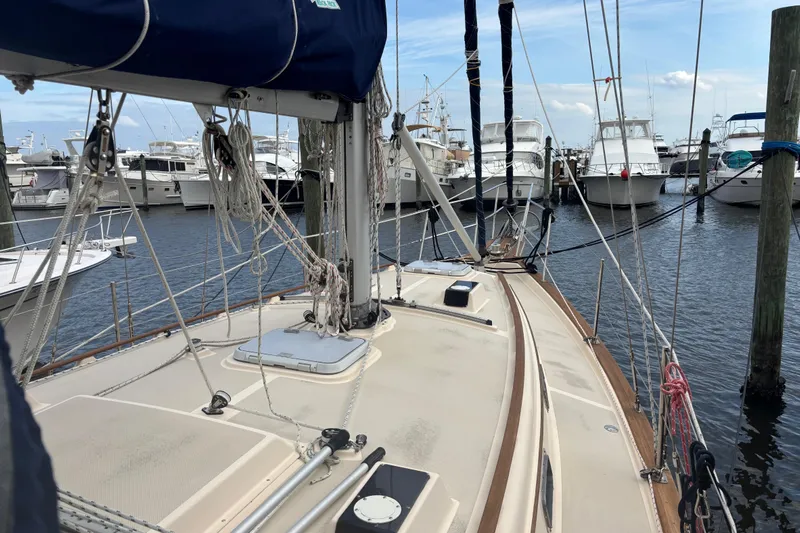Starlight Yacht Photos Pics 1995 Island Packet 37 sailboat docked at marina with other boats.