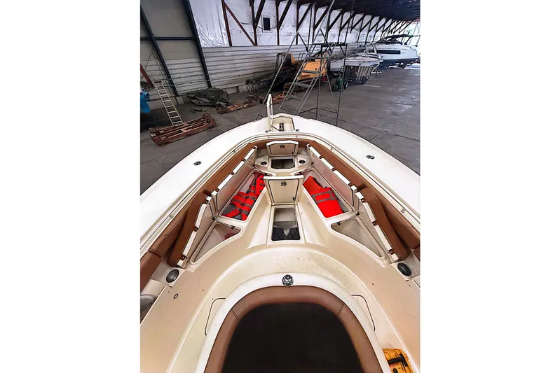  Yacht Photos Pics 2016 Scout 350 LXF boat interior with seating and storage in a warehouse.
