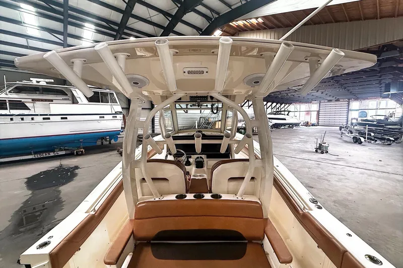  Yacht Photos Pics 2016 Scout 350 LXF boat interior in a spacious indoor marina setting.