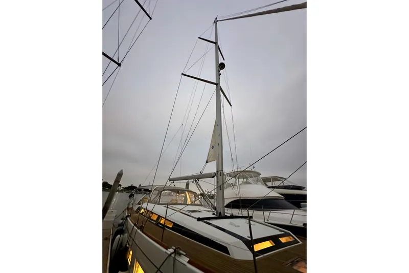 Champagne Yacht Photos Pics 2021 Beneteau Oceanis 55.1 sailboat docked, showcasing mast and sleek design.