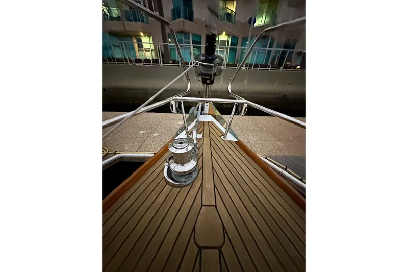 Champagne Yacht Photos Pics Bow view of 2021 Beneteau Oceanis 55.1 yacht with teak deck and winch.