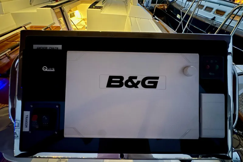 Champagne Yacht Photos Pics B&G navigation system on a 2021 Beneteau Oceanis 55.1 yacht, illuminated at dusk.