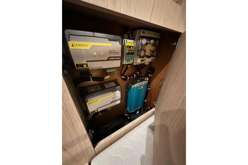Champagne Yacht Photos Pics Electrical system components inside a 2021 Beneteau Oceanis 55.1 yacht cabinet.
