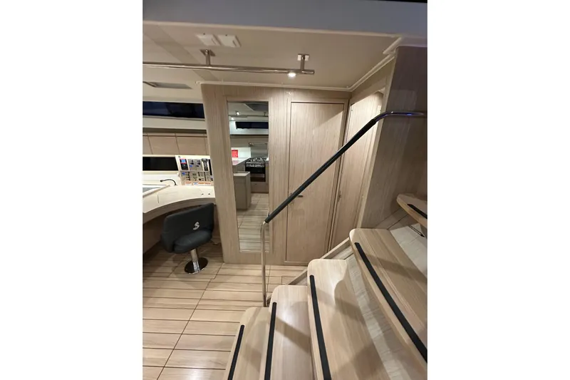 Champagne Yacht Photos Pics Interior of 2021 Beneteau Oceanis 55.1 yacht, featuring modern design and wooden finishes.
