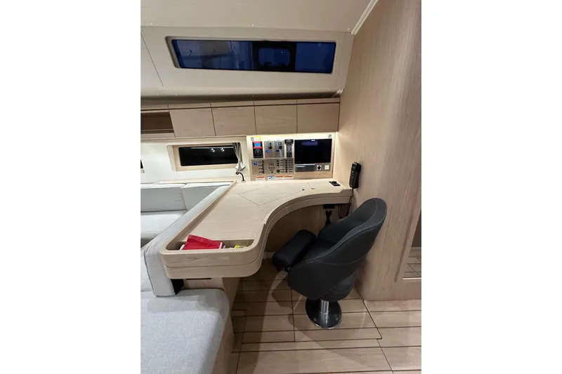 Champagne Yacht Photos Pics Modern navigation station in 2021 Beneteau Oceanis 55.1 yacht interior.