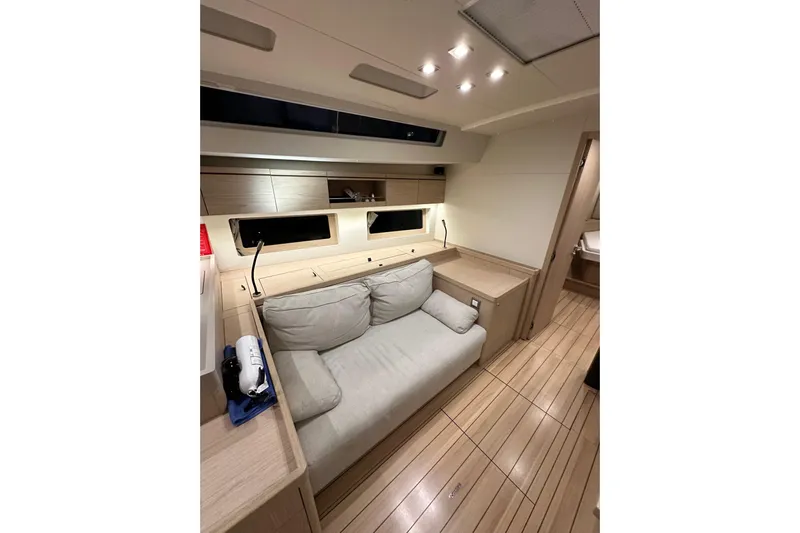 Champagne Yacht Photos Pics Luxurious interior of 2021 Beneteau Oceanis 55.1 yacht with modern furnishings.